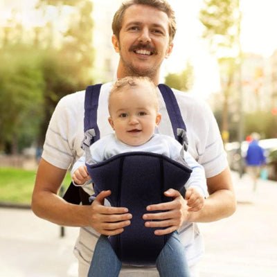Papa souriant avec porte-bébé mabeladi™