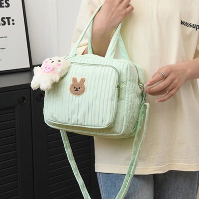 maman et sac a langer petit Douxie™ vert