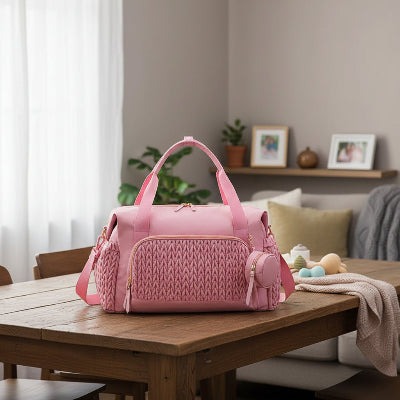 sac a langer rose Rosalune™ sur table