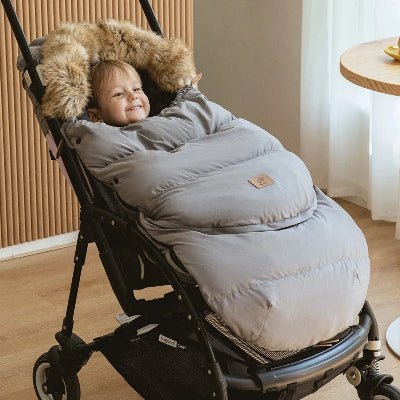 bebe dans chanceliere pour bebe Doucinou™ gris