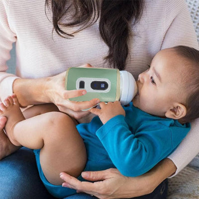 maman avec chauffe biberon nomade calinlait™