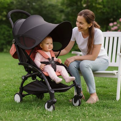 maman et bébé au parc avec ombrelle poussette Sunéo™