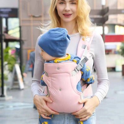 maman et porte bébé Étreindou™ rose